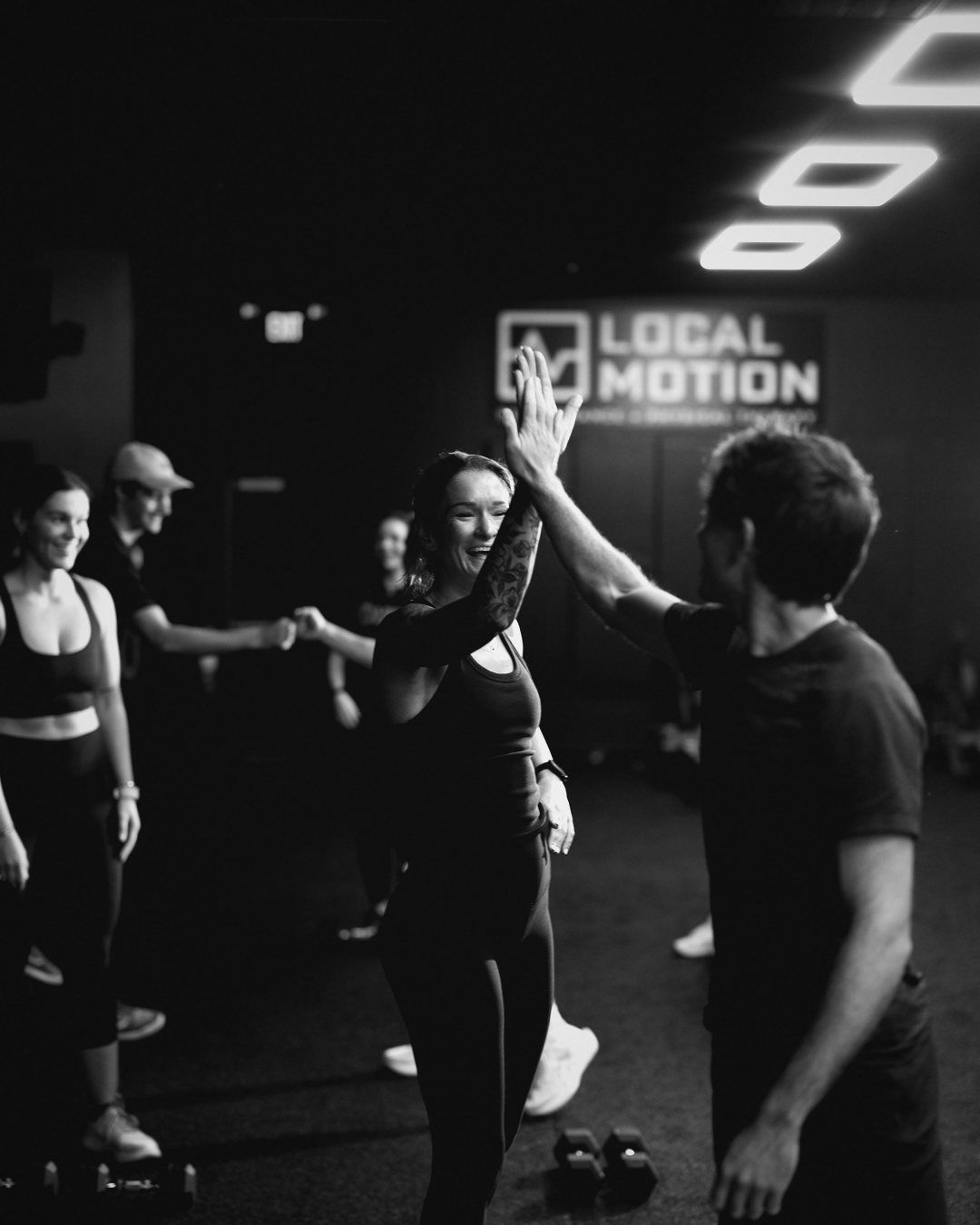 Members high-fiving mid-class